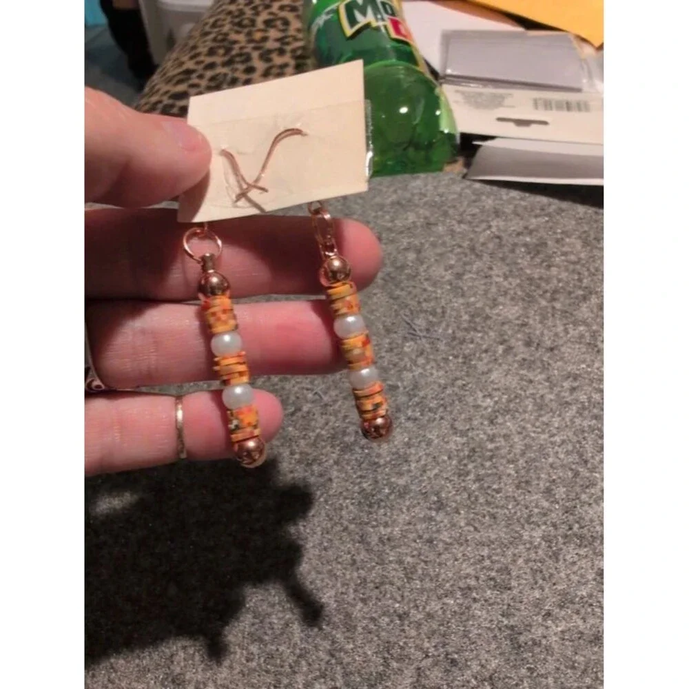 Orange and pearl beaded dangle earrings